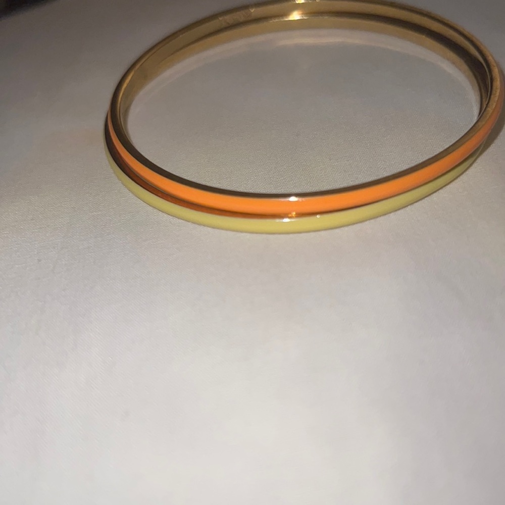 2  J.crew bangle bracelets. Pop of orange and pale yellow Like-new condition.